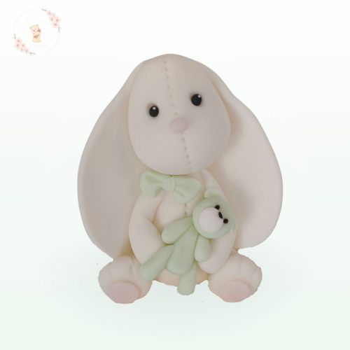 fehér nyuszi tortadísz zöld játékkal pasztell színekben